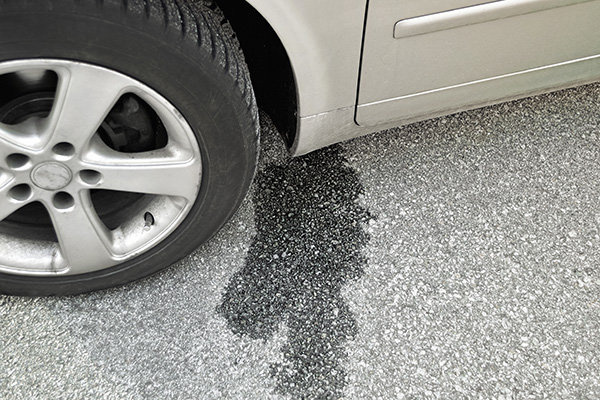Why Ignoring Small Leaks From Your Vehicle Costs Big Later